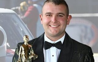 Photo of Brandon Miller with trophy