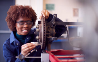 Student Working with Machinery