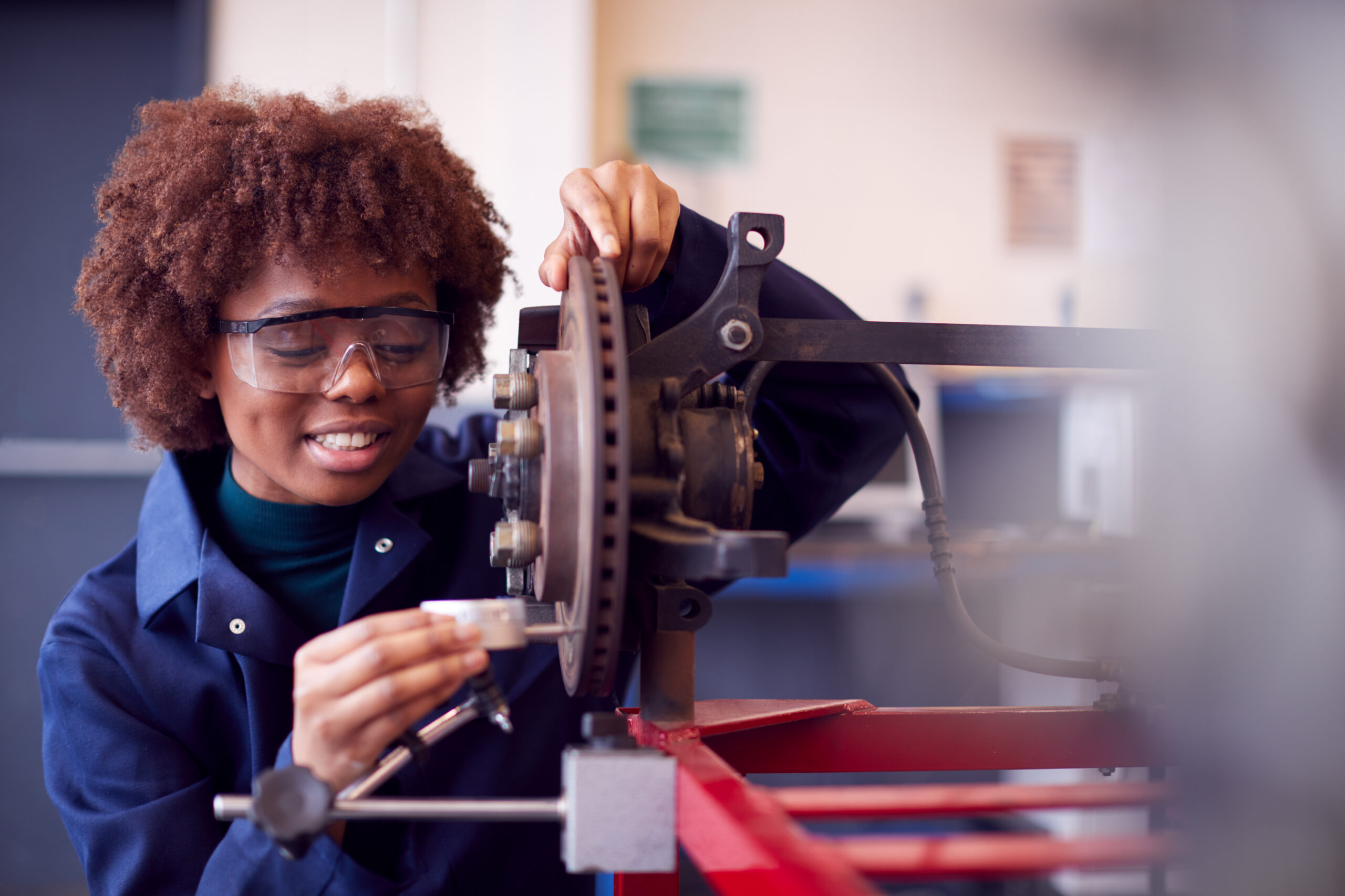 Student Working with Machinery